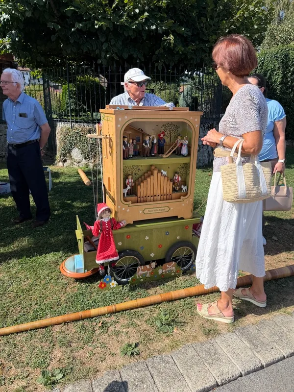 A street organ player at the Rolle Street Organ Festival.jpg